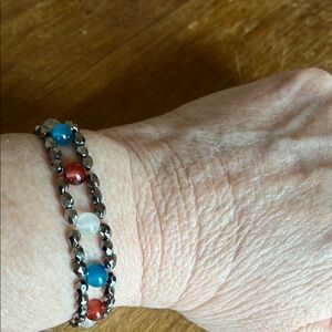 Elegant Beaded Bracelet with Red, Blue, and Silver Accents